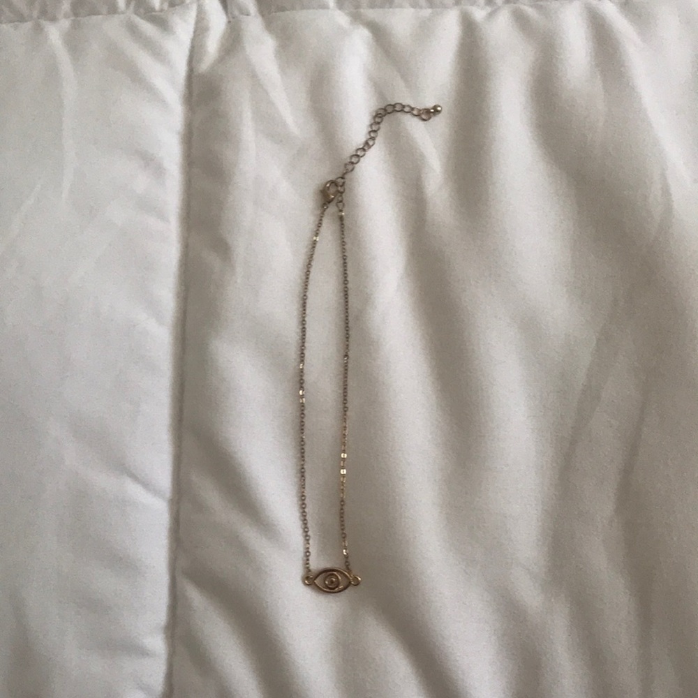 A gold eye necklace